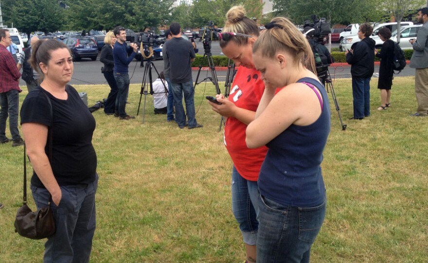 Parents and family members gather at the Cherry Park Safeway in Troutdale, Oregon.