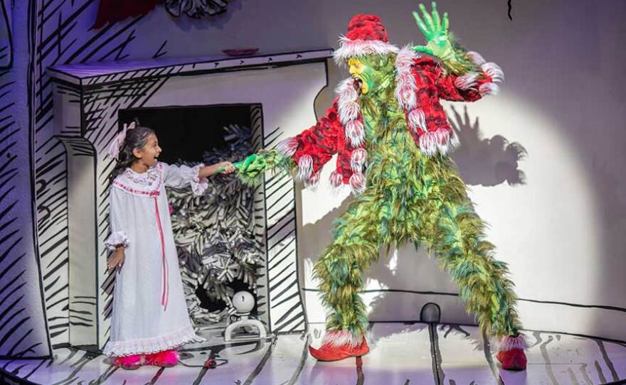 The Old Globe and KPBS will pair up to bring "Dr. Seuss's How The Grinch Stole Christmas!" to a new radio play format while theaters remain closed. Edward Watts, pictured at right in this November 2019 photo, will play The Grinch.