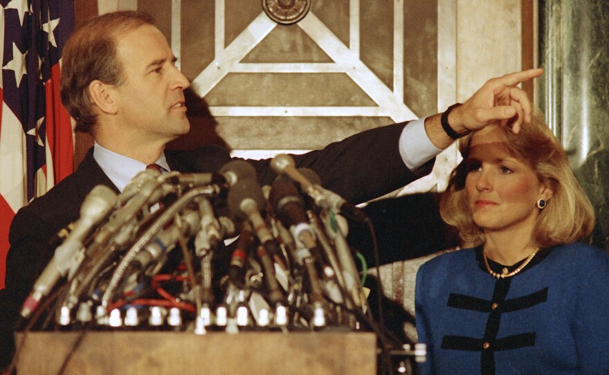 Joe Biden gestures during a news conference on Capitol Hill to announce his decision to withdraw as a candidate for the 1988 Democratic presidential nomination.