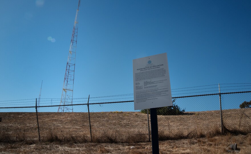 A posted notice of application is shown on Wednesday, Dec. 18, 2024 on the site of a planned housing development in Emerald Hills that relies on the footnote.