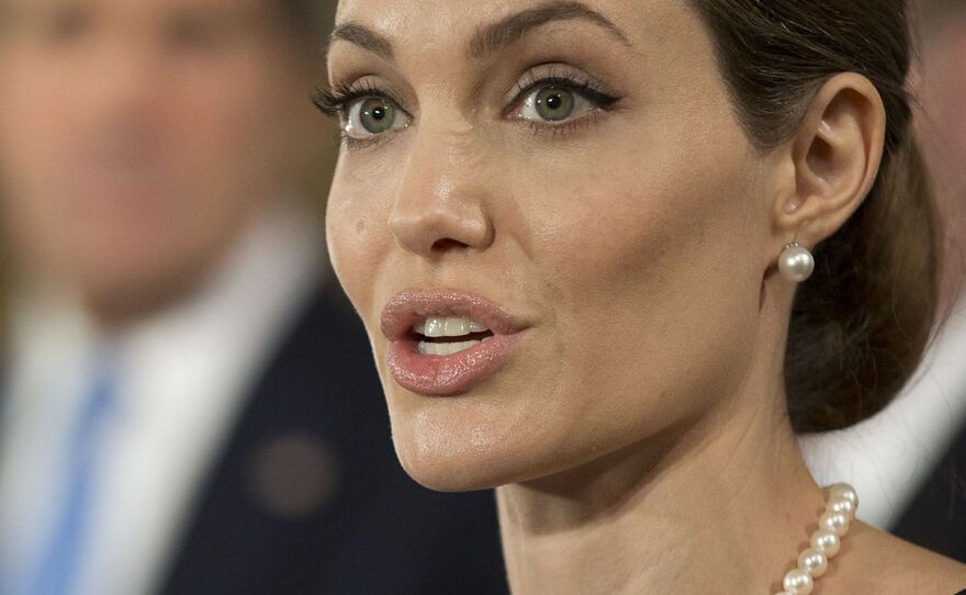 Actress Angelina Jolie at a news conference with Secretary of State John Kerry (in background) and other foreign ministers in London last month. They held a forum on how to reduce sexual violence against women in conflict zones — an issue she has often spoken about.