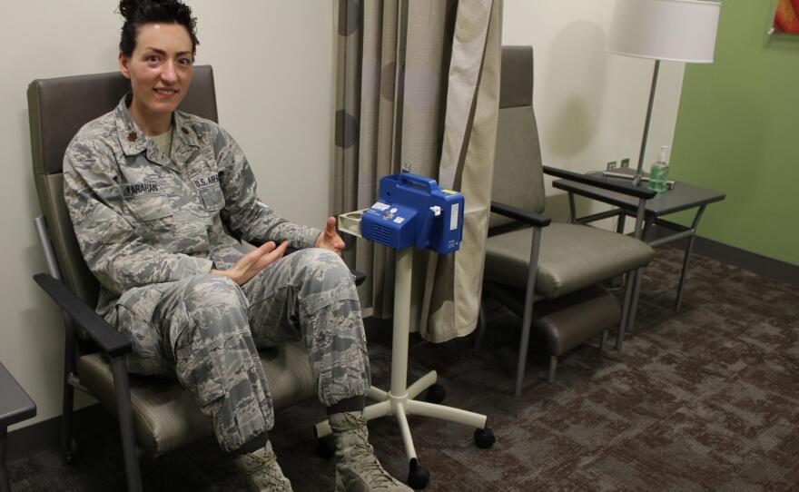 Maj. Crystal Karahan, an Air Force medical officer, demonstrates the correct posture for nursing a child in the lactation room at Wilford Hall Ambulatory Surgery Center in this undated photo.