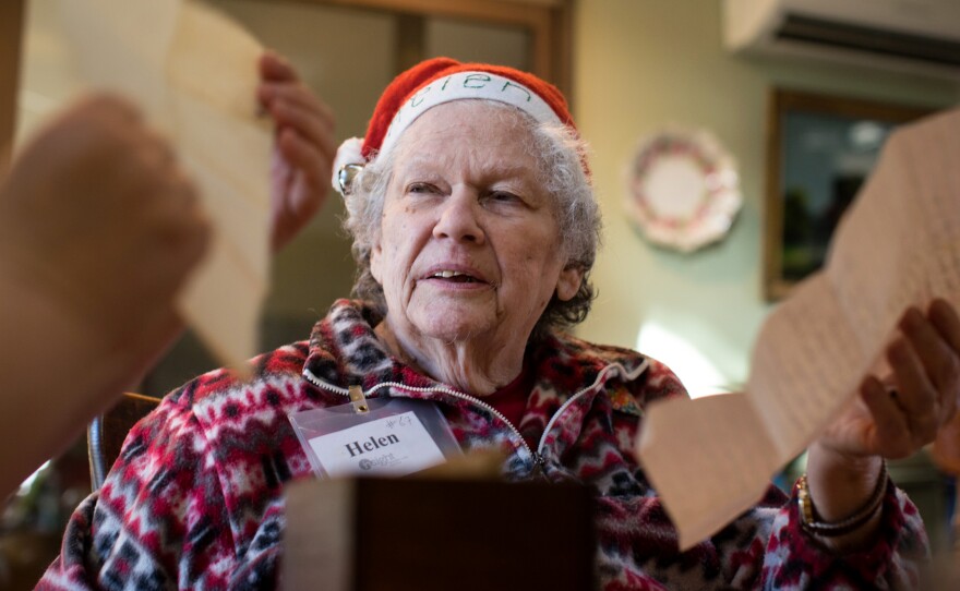 Helen Downs looks through some of her old recipes with her daughter-in-law Mary Downs. Helen used to be a big baker, but now Mary does most of the cooking.