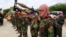 Militants belonging to Somalia's Al Qaeda-inspired Al Shabaab Islamists stand in formation on October, 21, 2010 during a show of force in Somalia's capital Mogadishu