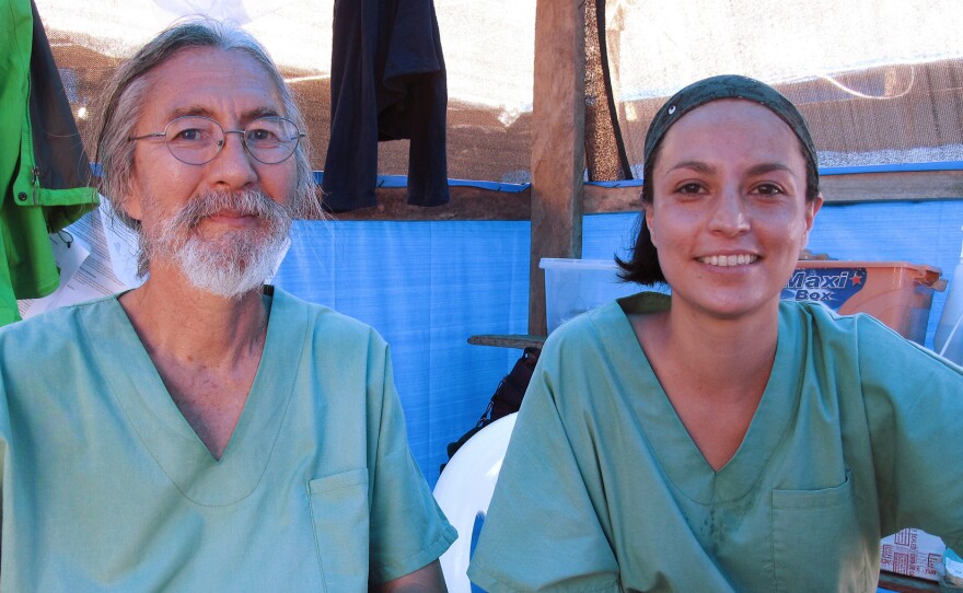 Dr. Cedric Yoshimoto of Volcano, Hawaii, and Dr. Citlali Barba of Mexico City cared for both Edwin Koryan and his granddaughter Komasa at the Ebola treatment center run by Doctors Without Borders in Foya, Liberia.