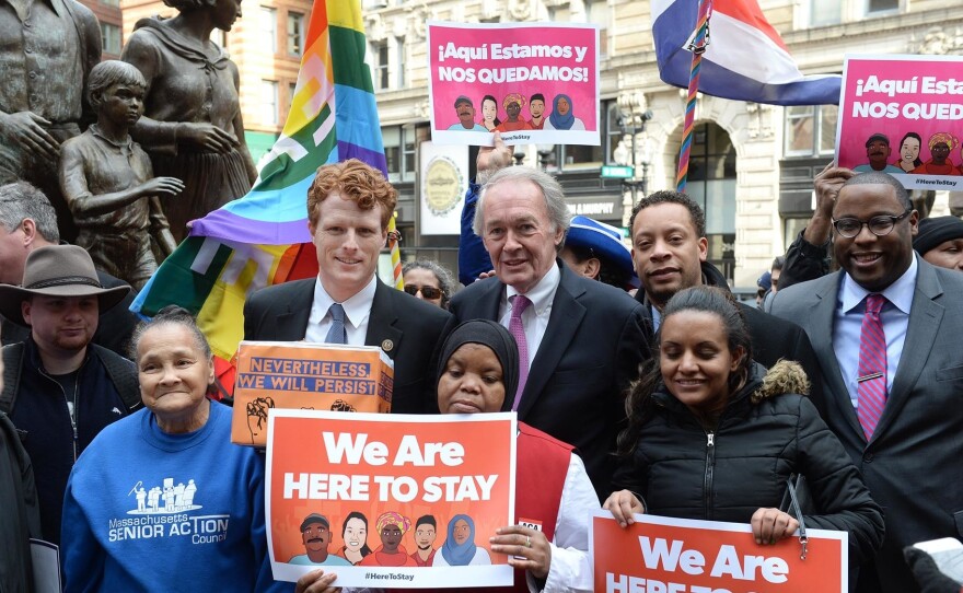 U.S. Rep. Joe Kennedy III (D-Mass.), center left, and  Sen. Edward Markey (D-Mass.), center right (R) during a 2017 protest against Trump administration immigration policies. The two lawmakers face each other in a Democratic primary this Tuesday.
