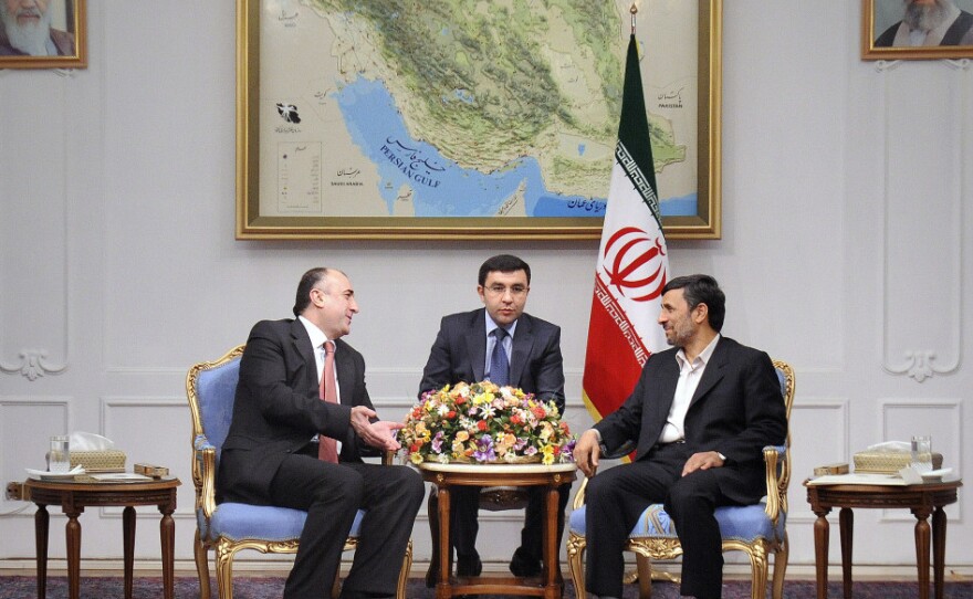 Iranian President Mahmoud Ahmadinejad (right) meets with Azerbaijan's foreign minister, Elmar Mammadyarov (left) in Tehran in March 2011. Tensions have been growing between the countries, including a recent incident in which Tehran summoned the Azerbaijani ambassador to protest alleged Israeli intelligence activity in Azerbaijan.