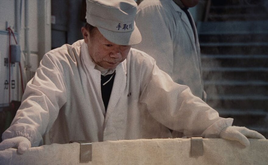 Yamamoto Toji in front of rice vat.