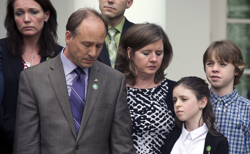 Family members of those killed in the Newtown, Conn., school shooting stand together as President Obama speaks at the White House on Wednesday, after gun control measures were defeated in the Senate. In the foreground are Mark and Jackie Barden with their children Natalie and James, who lost Daniel. Behind them are Nicole Hockley, mother of Dylan, and Jeremy Richman, father of Avielle.