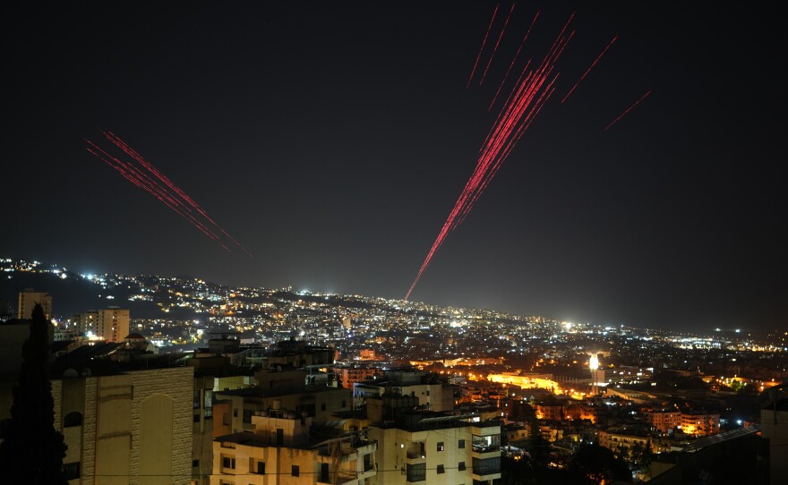Tracer rounds illuminate the night sky as people fire live ammunition and fireworks into the air as a ceasefire was beginning between Israel and Hezbollah, in Beirut, Lebanon, in the early hours of Friday.