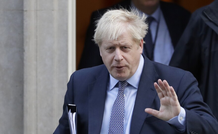 British Prime Minister Boris Johnson leaves No. 10 Downing St. to go to the Houses of Parliament in London on Saturday.