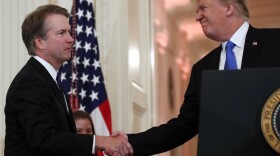 President Donald Trump shakes hands with Judge Brett Kavanaugh his Supreme Court nominee, in the East Room of the White House, Monday, July 9, 2018. 
